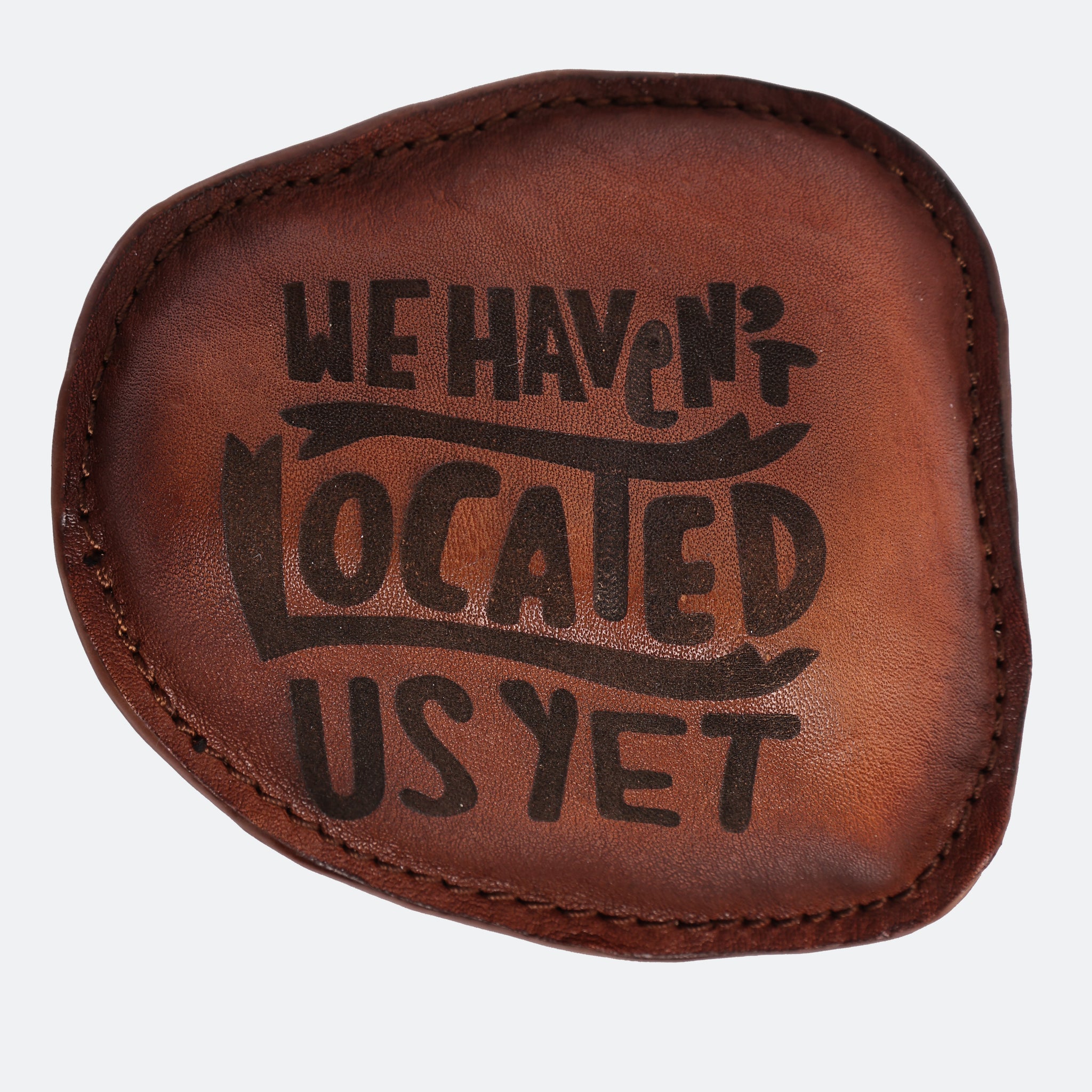 40/41 “We Haven’t Located Us Yet” Leather Paperweight