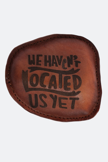 40/41 “We Haven’t Located Us Yet” Leather Paperweight