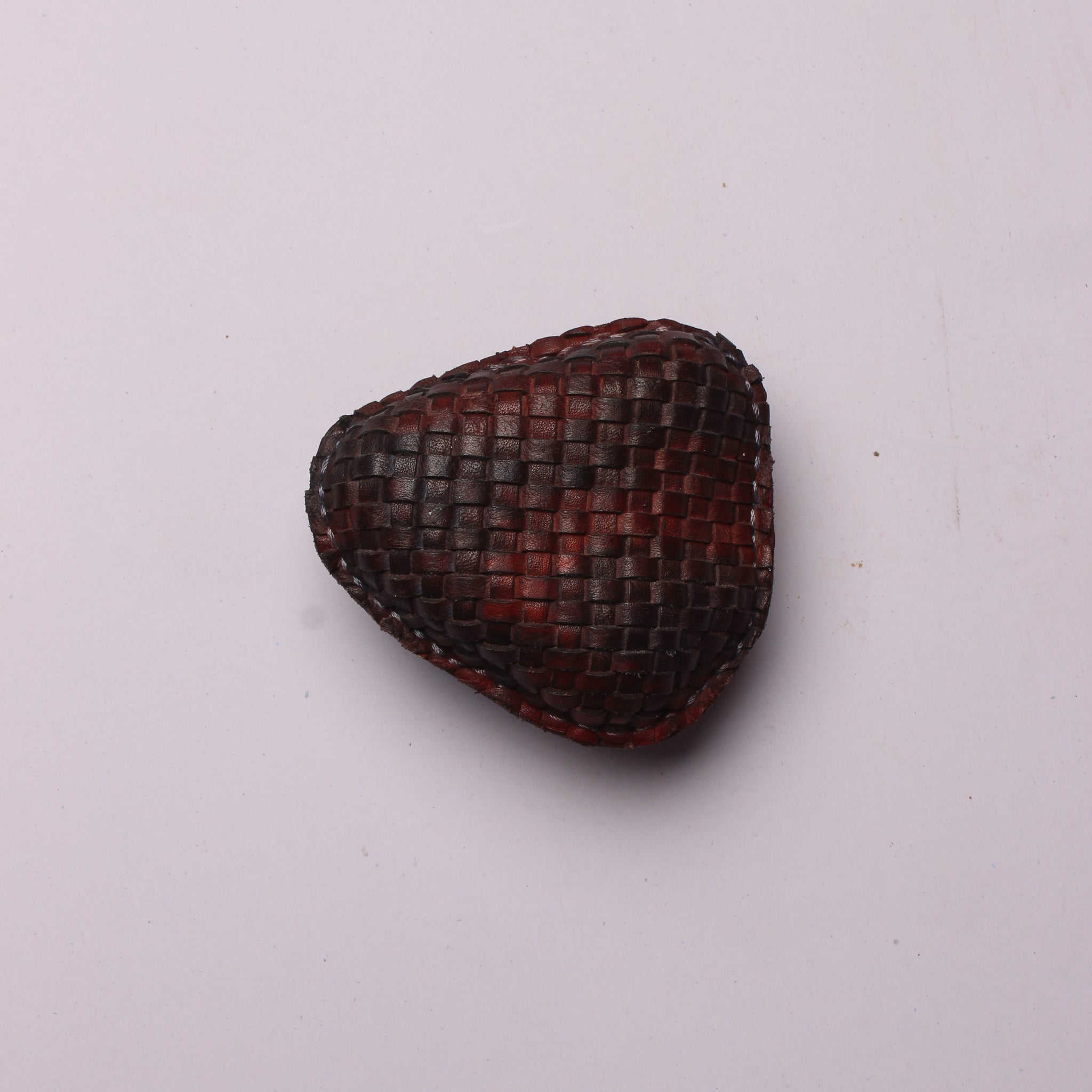 Woven Elegance: Leather Crafted Paperweight